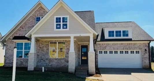 New home with a white windowed garage door
