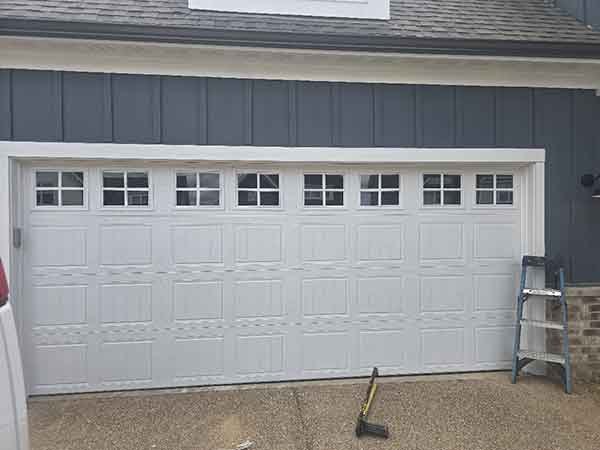White double garage door with window panels